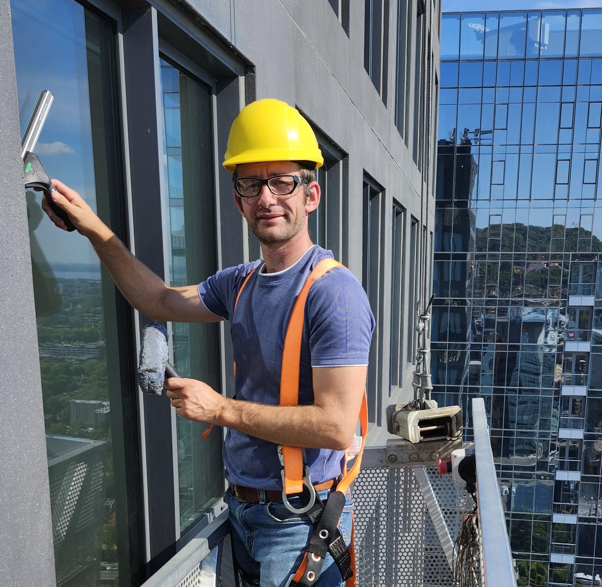 Professional during window cleaning
