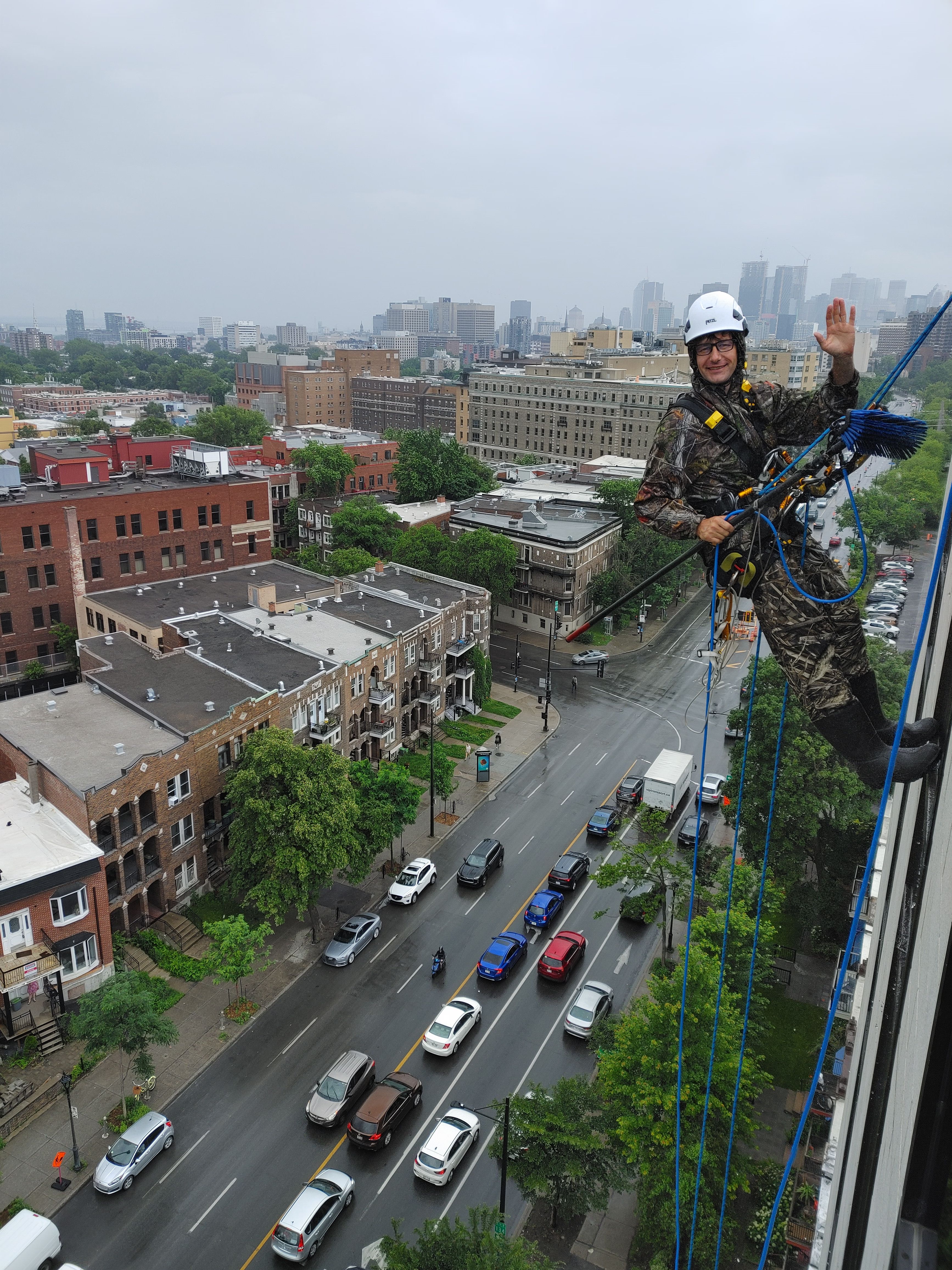 Professional window cleaning on high-rise building in Montreal